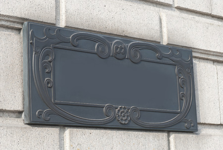 a doorplate on the wall in vintage style.の写真素材