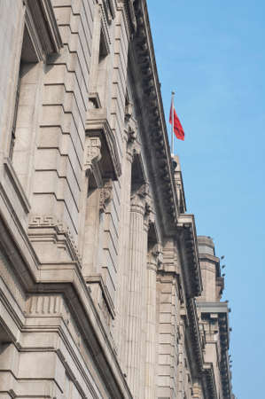 a landmarks of shanghai china with a china flagの写真素材