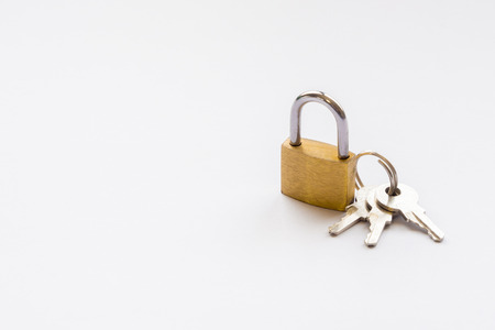 hinged lock with keys on white backgroundの写真素材