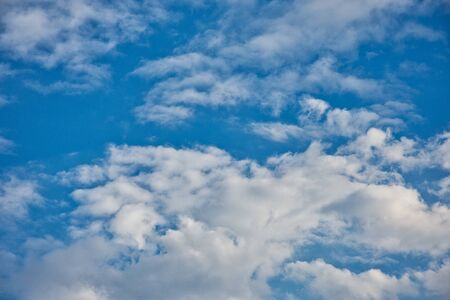 Blue sky contrasted with fluffy diamond-white cloud in one fine day and fresh air to take a fully breath ,of course.の写真素材