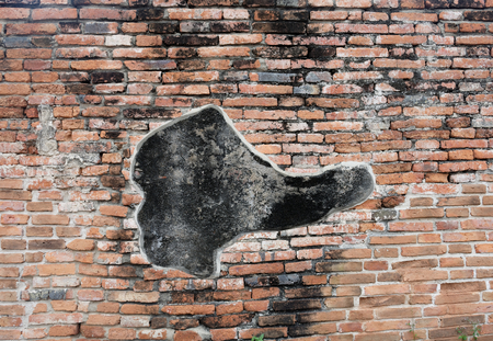 A cracked mark on the ancient bricked wall which is coincidently resemble to a short boot. Taken from  Wat Phraram, Phra Nakhon Si Ayutthaya Province , Thailand.の写真素材