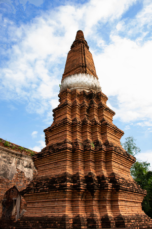 A pagoda stands elegantly near Lopburi railway staion , with blue sky and the white cloud.のeditorial素材