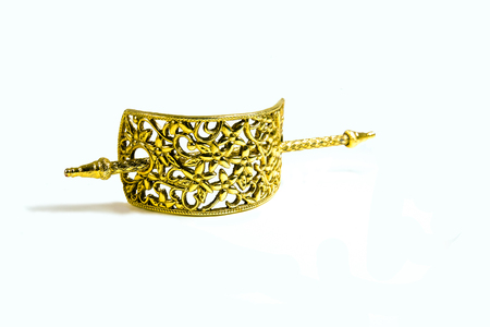 Bronze handcraft hairpin isolated on white background.の写真素材