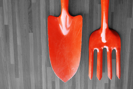 Orange Shovel and spade on grey background.の写真素材