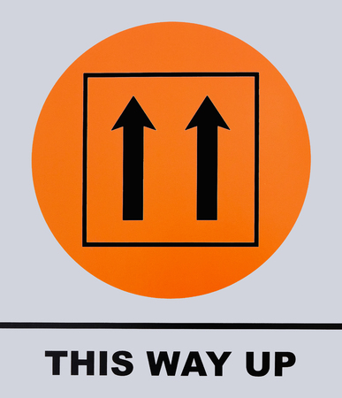 This way up sign, isolated on white background. This photo was taken from the sign board, it is not...