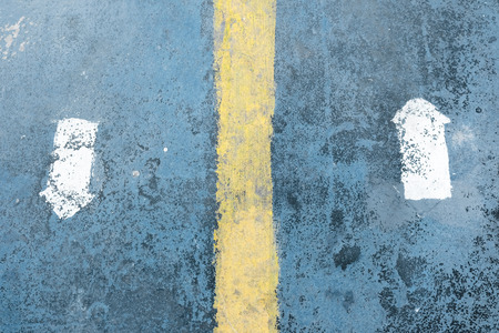Arrow sign marks as direction on the dirty pathway.の写真素材