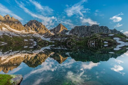 Reflections of Caucasus Mountain on Tobavarchkhili lake, Trekking, Hiking, Svaneti, Georgiaの写真素材