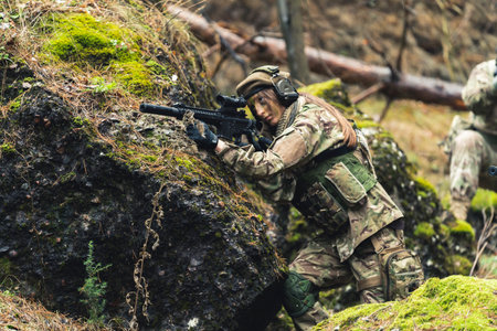 Machismo feminine sergeant leading British task force aiming to attack . High quality photoの写真素材