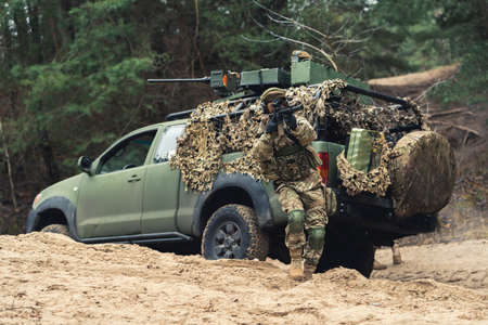 Legal army intrusion frightening hidden civilians with bulletsの写真素材