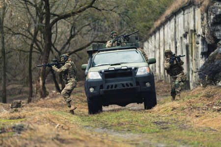 Intense regiment of women leading ambush at war zone. High quality photoの写真素材