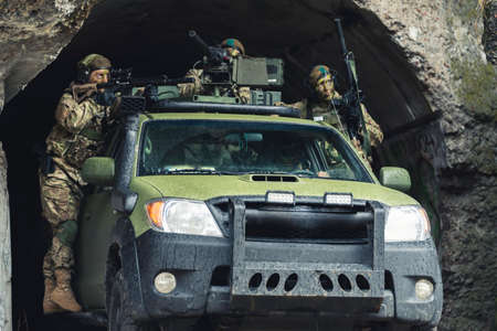 Suppressing cover in a cave by womens battalion defensive . High quality photo