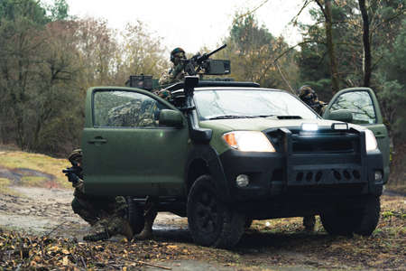 Trio outlaw soldiers being defensive at battlefield . High quality photoの写真素材