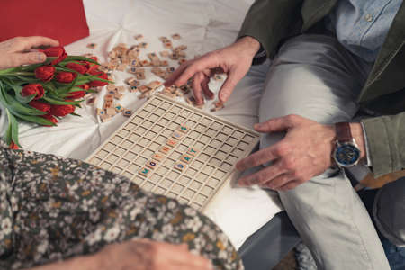 caucasian middle-aged man playing vocabulary games with his elderly mother durimong Mothers Day. High quality photoの写真素材