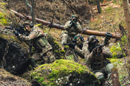 Prime corps targeting multiple targets in the woods . High quality photoの写真素材
