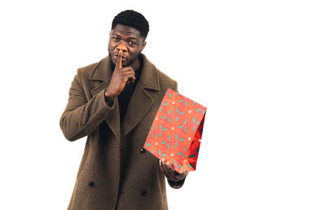 upcoming silent surprise black man white background - medium shot. High-quality photoの写真素材