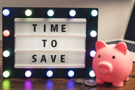 Time to save phrase written on marquee lightbox - savings concept. High quality photoの写真素材