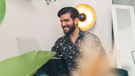 handsome man working from home remote job concept indoors medium shot . High quality photoの写真素材