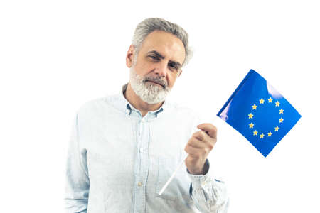 Middle-aged enterprenuer holding an EU flag - isolated white background. High quality photo