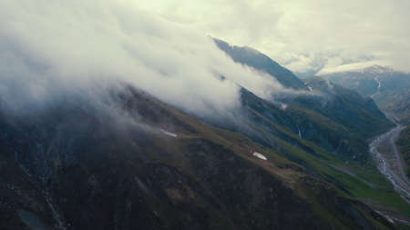 clouds over Caucasus mountains, Kazbegi, Stepantsminda, Georgia. drone shot. High quality photoの写真素材