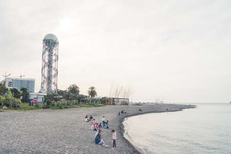 05.14.2022 - Batumi, Georgia people sitting on the Black Sea beach in Batumi in the cloudy weather. High quality 4k footageのeditorial素材