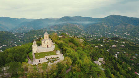 awesome aerial shot of Sameba Holy Trinity Cathedral Church, green and magnificent landscape. High quality photoの写真素材