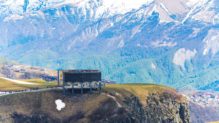 18.05.2022. Gudauri, Georgia. Georgian-Russian friendship Monument on the marvelous Caucasus mountains background. High quality photoのeditorial素材