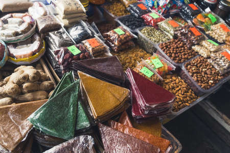 counter of nuts and Georgian traditional sun-dried pureed fruit sheets called Tklapi. High quality photoの写真素材