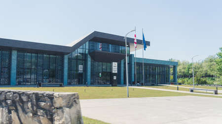 16.05.2022. Batumi, Georgia. modern building with Georgia and EU flags in front of it. High quality...