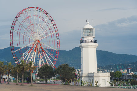 the lighthouse and the Ferris wheel in Batumi city, Adjara, Georgia. High quality photoの写真素材