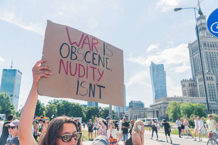 Warsaw, Poland 25.06.2022- young woman in glasses holding poster for judging the war - equality...