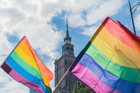 06.25.2022 Warsaw, Poland. Pride gay rainbow flags with the Palace of Culture and Science in Warsaw. Beautiful weather, high temperature. Pride month. High quality photoのeditorial素材