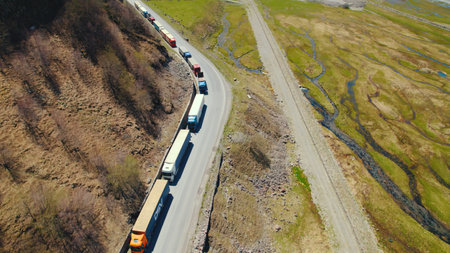 long queue of trucks on the border of Georgia and Russia, Kazbegi, Georgia. High quality photoの写真素材