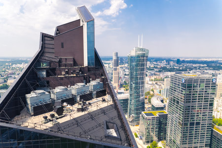 7.22.2022 Warsaw, Poland. The top of the roof of Skyliner skyscraper placed in Wola district. City development concept. Engineering and building. High quality photoのeditorial素材