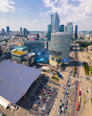 7.22.2022 Warsaw, Poland. Vertical outdoor shot. Sunny weather. Zlota 44 skyscraper in the background. Zlote Tarasy as a part od blob architecture. Central railway station. High quality photoのeditorial素材
