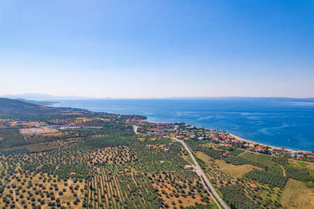 Beautiful aerial view at Torones Kolpos. Clear blue sky, and amazing dark blue sea water. Greek houses with orange roofs. High quality photoの写真素材
