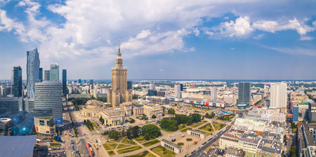 7.22.2022 Warsaw, Poland. Vide panoramic drone shot of Palace of Culture and Science and its surroundings. Beautiful summer weather, blue sky with some white fluffy clouds. High quality photoのeditorial素材