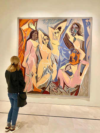 30.10.2021. Malaga, Spain. blond girl standing in front of Pablo Picassos one of the most famous painting called Les Demoiselles dAvignon in Picasso Musseum in Malaga. High quality photoのeditorial素材