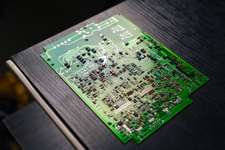 Modern technology. Ready to use components and microchips on PC circuit board lying down black...