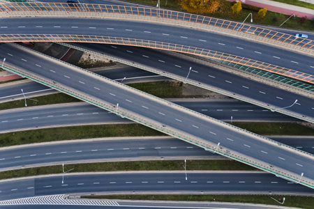 Modern road building. Many empty asphalt roads and expressways on top of each other. Traffic not in rush hours. Top aerial view. High quality photoの写真素材