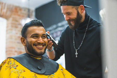 Professional hairdresser cutting hair of the male client. High quality photoの写真素材