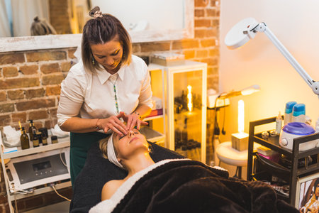 A woman getting a facial massage in a spa beauty salon. High quality photoの写真素材