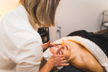 A woman getting a facial massage in a spa beauty salon. High quality photoの写真素材
