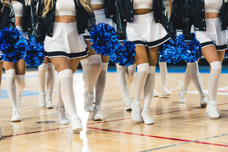Knee level shot. A group of cheerleaders in white skirts and knee socks. Sport cocnept. High quality photoの写真素材