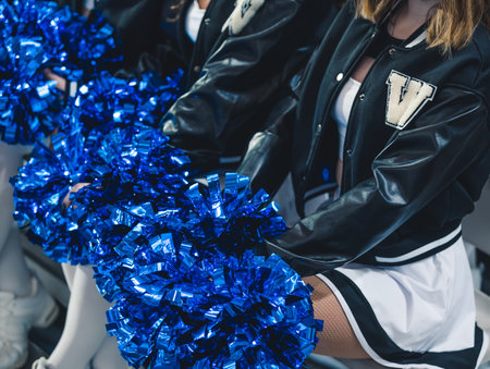 Close-up shot. Blue pom-poms held by cheereladers. Sport concept. High quality photoの写真素材