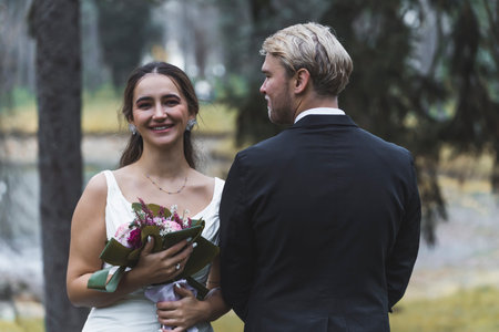 Bride and Groom happy in autumn park. High quality photo