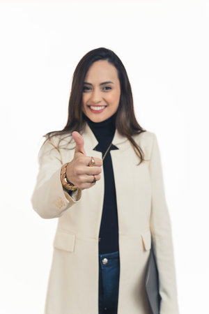 Confident young woman holding a black file making thumb up gesture getting a job. High-quality photo