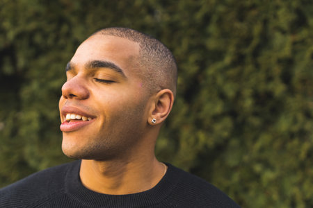 Man taking deep breath enjoying morning in the yard - relax and healthy lifestyle. High quality photoの写真素材