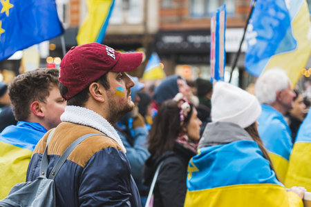 02.28.2023 - Nottingham, United Kingdom - people from protest wearing Ukrainian flags. High quality photoのeditorial素材