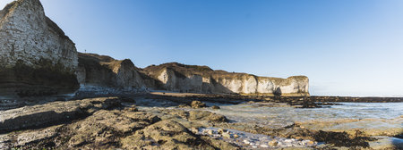 Wild white chalk cliffs at the seashore of England. Beach concept. Flamborough Head. Panoramic...