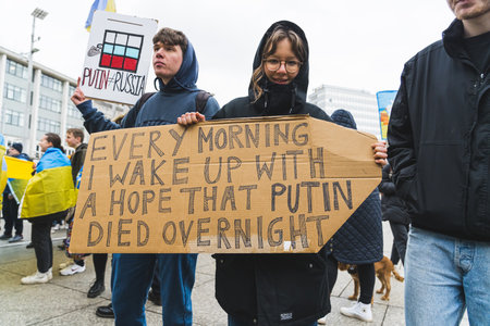 02.28.2023 - Nottingham, United Kingdom - young girl and boy holding a banner at the protest for...
